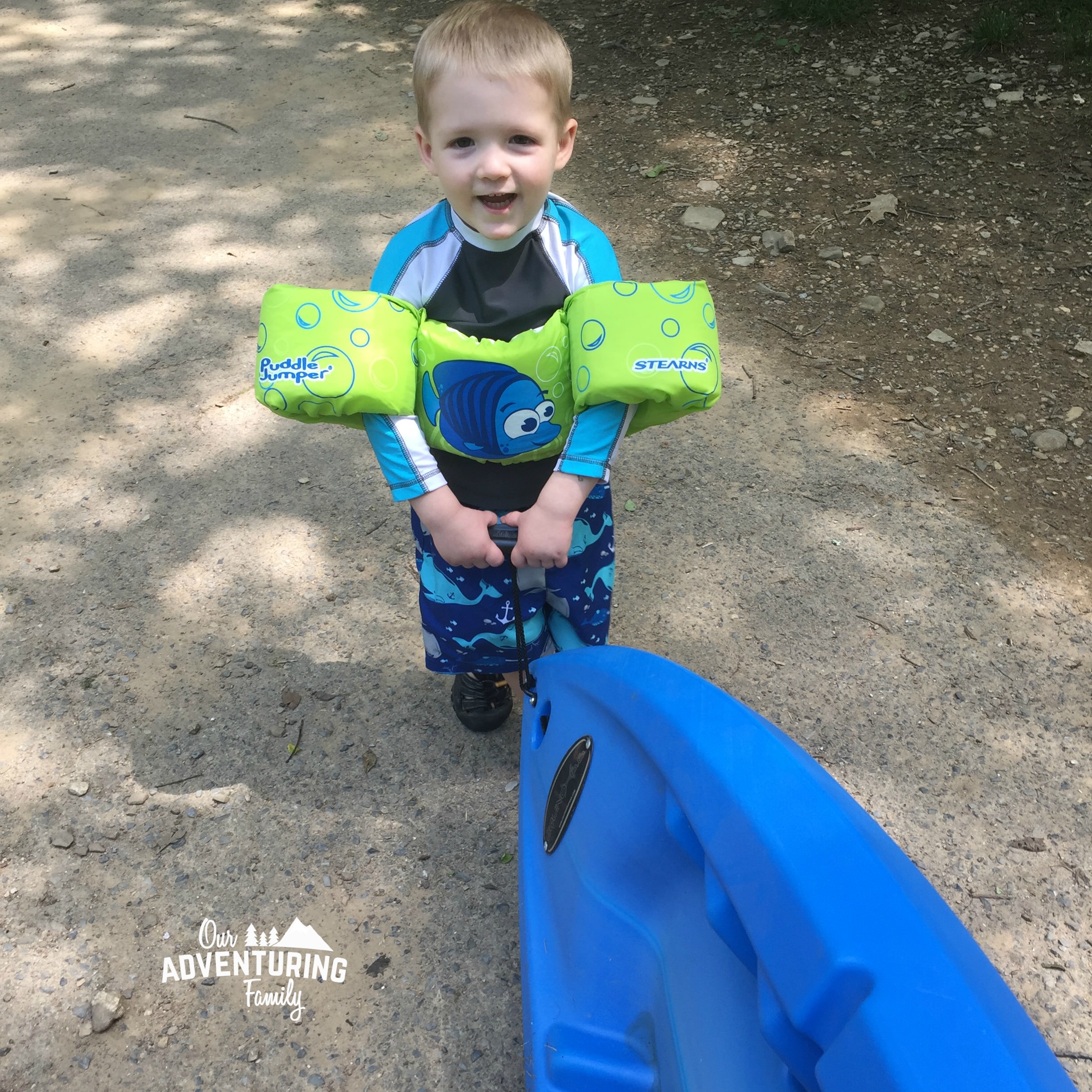 8 steps to kayaking with kids. Toddlers love to help, so give them a job when you take them kayaking. Learn what you need to do to give it a try at ouradventuringfamily.com.