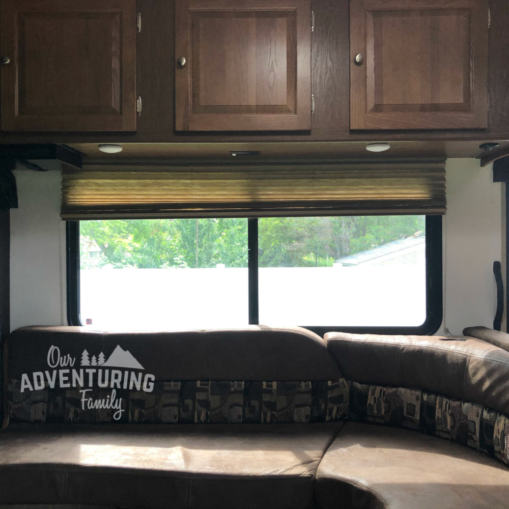 With a little paint and wallpaper we turned our dark cave of an RV into a brighter space. And it cost less than $200! Go too ouradventuringfamily.com to find out how we did it.