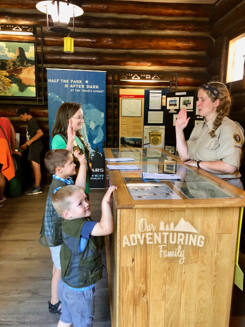 Online Junior Ranger programs can be a good way to learn about the national parks while social distancing this summer. Fun & learning for the whole family. Find out more at ouradventuringfamily.com.